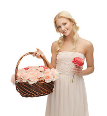 Image showing woman with basket full of flowers