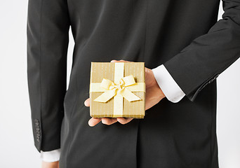 Image showing man hands holding gift box