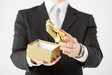 Image showing man hands holding gift box