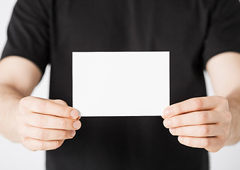 Image showing man hand with blank paper