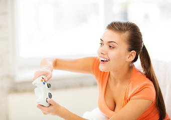 Image showing woman with joystick playing video games