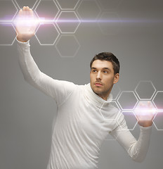 Image showing futuristic man working with virtual screens