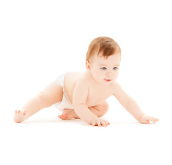 Image showing crawling curious baby