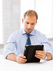 Image showing businessman with tablet pc in office