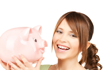 Image showing lovely girl with big piggy bank