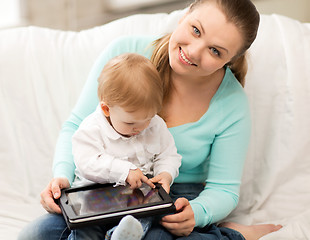 Image showing mother and adorable baby with tablet pc