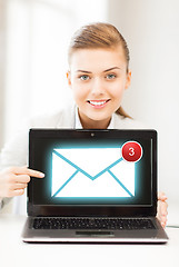 Image showing businesswoman with laptop in office