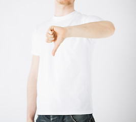 Image showing man showing thumbs down