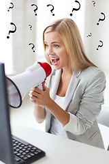 Image showing crazy businesswoman shouting in megaphone