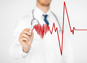 Image showing doctor drawing electrocardiogram on virtual screen