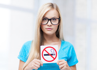 Image showing woman with smoking restriction sign