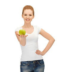 Image showing woman in blank t-shirt eating green apple