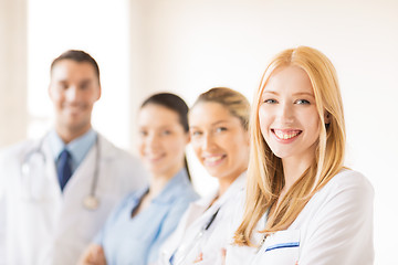 Image showing female doctor in front of medical group