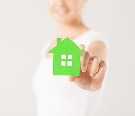 Image showing woman hands holding green house