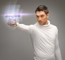 Image showing futuristic man with gadget