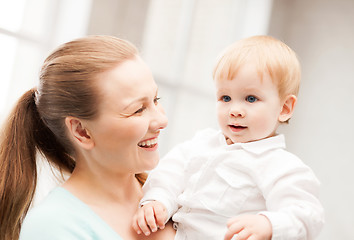 Image showing happy mother with adorable baby