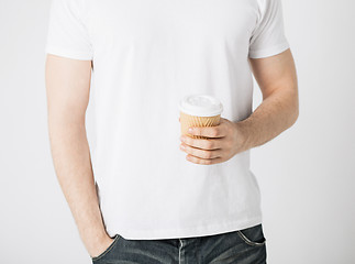 Image showing man hand holding take away coffee