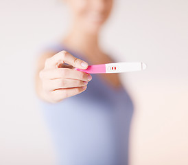 Image showing woman with pregnancy test