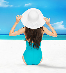Image showing model posing in swimsuit with hat