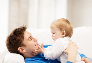 Image showing happy father with adorable baby