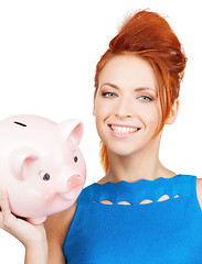 Image showing lovely woman with big piggy bank