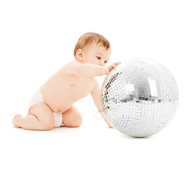 Image showing child playing with disco ball