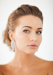 Image showing woman wearing shiny diamond earrings