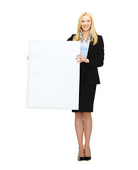 Image showing businesswoman with white blank board