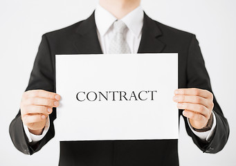 Image showing man hands holding contract paper