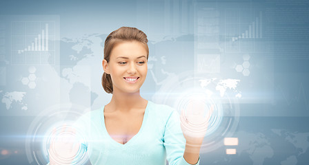 Image showing businesswoman working with virtual screens