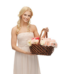 Image showing woman with basket full of flowers