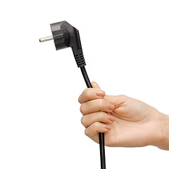 Image showing hand holding black electrical plug with wire