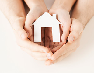 Image showing woman and hands with paper house