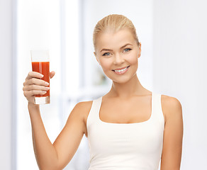 Image showing woman holding glass of tomato juice