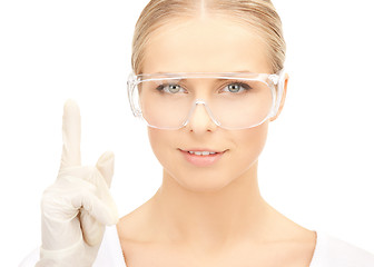 Image showing scientist in eyeglasses holding finger up