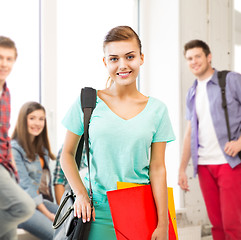 Image showing student girl with school bag and color folders