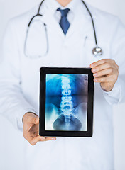 Image showing male doctor holding tablet pc with x-ray