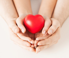 Image showing woman and man hands with heart