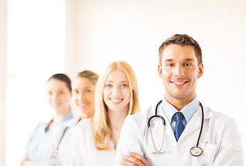 Image showing male doctor in front of medical group