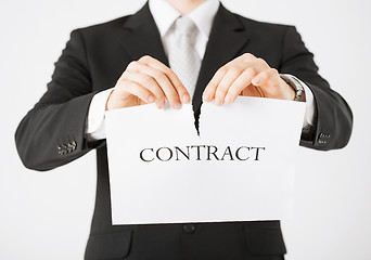 Image showing man hands tearing contract paper