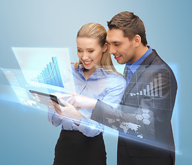 Image showing two business people working with virtual screen