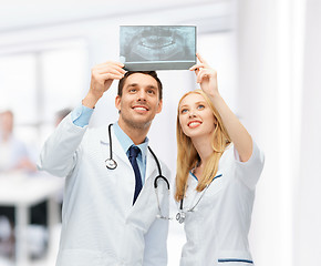 Image showing two doctors looking at x-ray