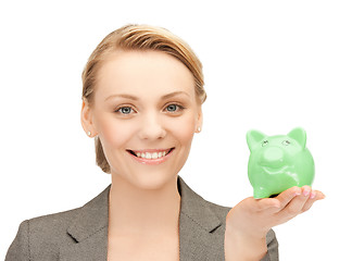 Image showing lovely woman with small piggy bank