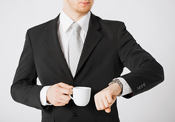 Image showing man looking at wristwatch