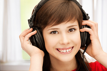 Image showing happy teenage girl in big headphones