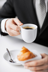 Image showing man with tablet pc and cup of coffee