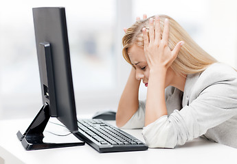 Image showing stressed woman with computer