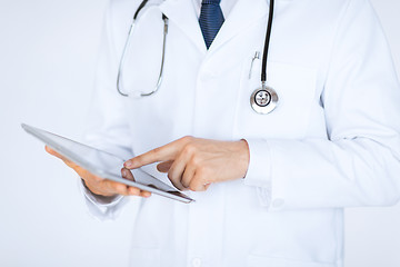 Image showing male doctor holding tablet pc