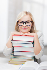 Image showing student with stack of books