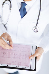 Image showing male doctor hands with cardiogram